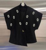 Black elegant waistcoat with green stones